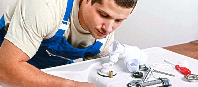 plumber investigating toronto drain installation after a handyman performed shoddy work