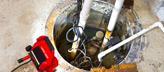 observing the sump pit after sump pump installation services carried out in the basement of a toronto home